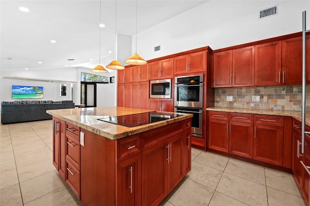 7350 SW 154th Ter, Palmetto Bay, FL 33157 - kitchen featuring stainless steel appliances, backsplash, light tile patterned floors, a kitchen island, and vaulted ceiling