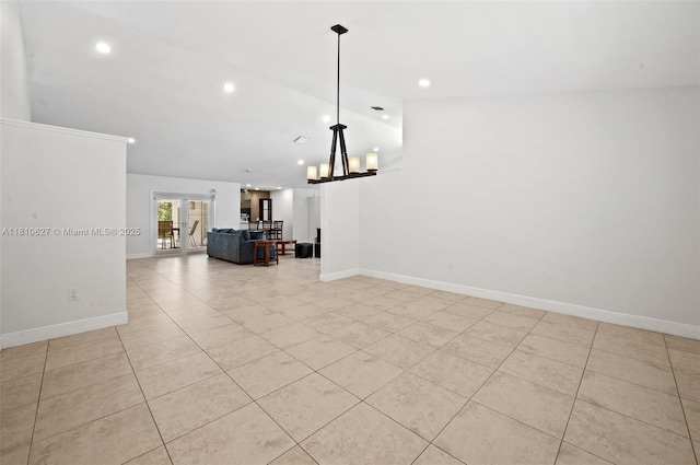 7350 SW 154th Ter, Palmetto Bay, FL 33157 - unfurnished living room with light tile patterned floors, baseboards, a chandelier, and recessed lighting
