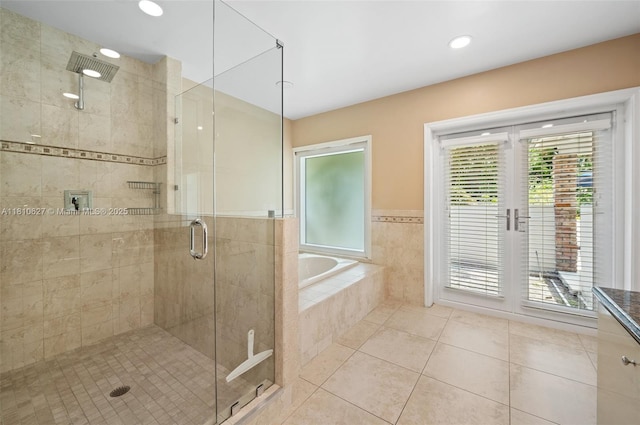 7350 SW 154th Ter, Palmetto Bay, FL 33157 - full bath featuring tile patterned floors, a shower stall, a bath, recessed lighting, and french doors
