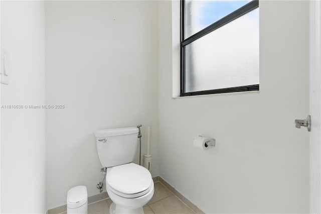 3534 W 106th St, Hialeah, FL 33018 - bathroom featuring toilet, tile patterned floors, and baseboards
