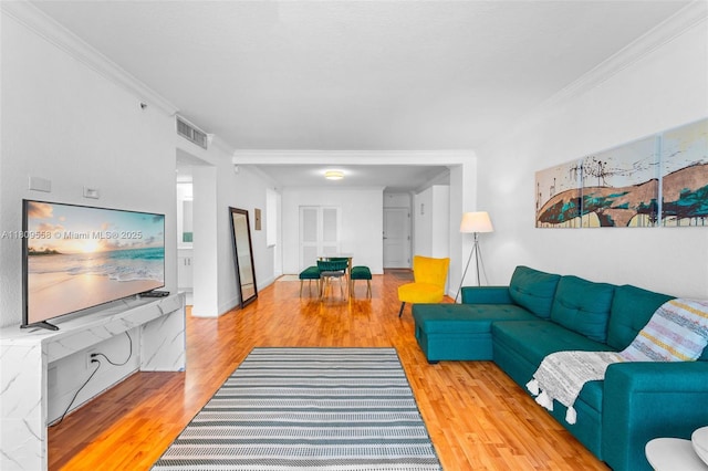 401 69th St Unit 708, Miami Beach, FL 33141 - living room featuring wood finished floors and ornamental molding