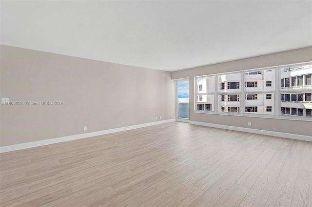 3700 Galt Ocean Dr Unit 1408, Fort Lauderdale, FL 33308 - empty room featuring light wood-type flooring and baseboards