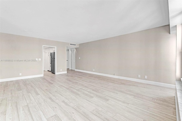 3700 Galt Ocean Dr Unit 1408, Fort Lauderdale, FL 33308 - spare room featuring light wood-type flooring and baseboards