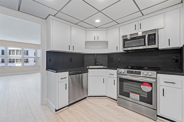 3700 Galt Ocean Dr Unit 1408, Fort Lauderdale, FL 33308 - kitchen with appliances with stainless steel finishes, a sink, dark countertops, white cabinetry, and recessed lighting