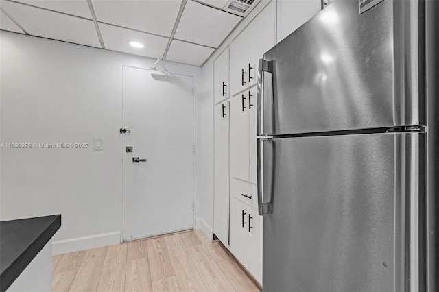 3700 Galt Ocean Dr Unit 1408, Fort Lauderdale, FL 33308 - kitchen with freestanding refrigerator, light wood-style floors, white cabinetry, recessed lighting, and baseboards