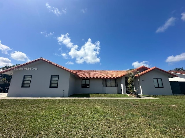 18781 SW 294th Ter, Homestead, FL 33030 - view of front of property with a tile roof, stucco siding, and a front yard