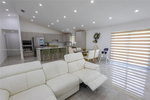 18781 SW 294th Ter, Homestead, FL 33030 - living area featuring vaulted ceiling, recessed lighting, light tile patterned floors, and baseboards