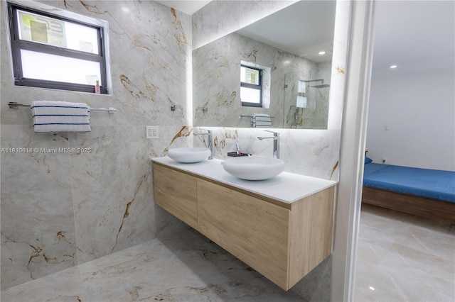 18781 SW 294th Ter, Homestead, FL 33030 - ensuite bathroom featuring double vanity, marble tiled floors, and a marble finish shower