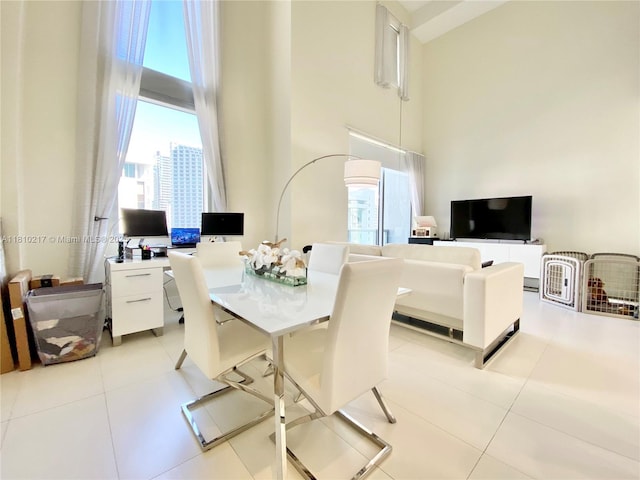 1060 Brickell Ave Unit 801, Miami, FL 33131 - dining space featuring a towering ceiling and light tile patterned flooring
