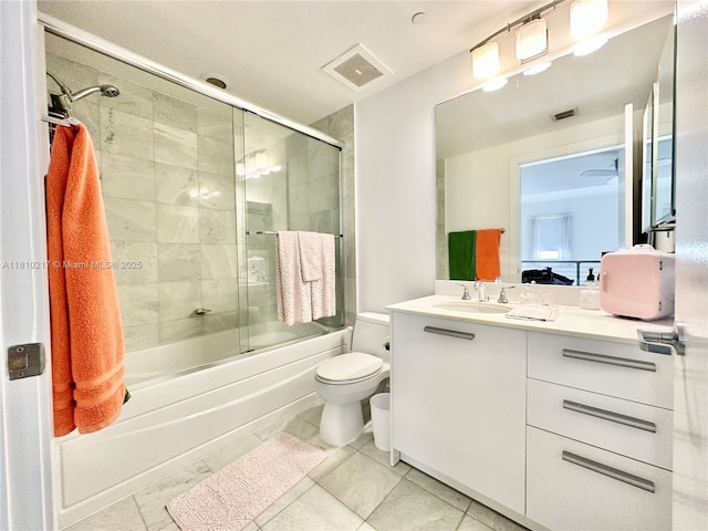 1060 Brickell Ave Unit 801, Miami, FL 33131 - bathroom featuring toilet, vanity, enclosed tub / shower combo, and tile patterned flooring
