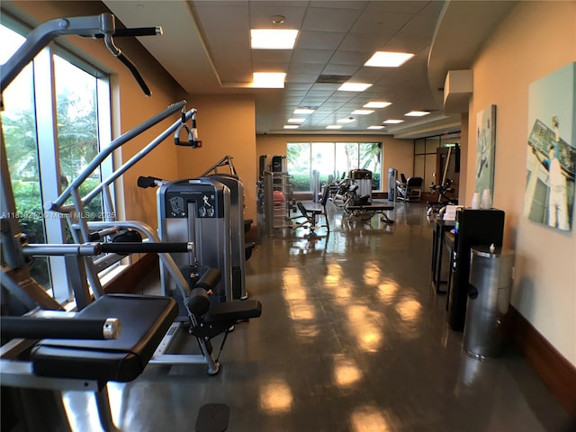 1060 Brickell Ave Unit 801, Miami, FL 33131 - workout area with a paneled ceiling and baseboards