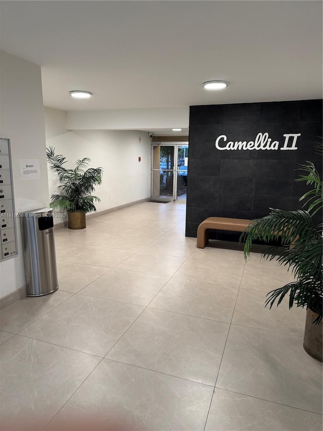 1780 NE 191st St Unit 412-2, Miami, FL 33179 - hallway featuring baseboards, light tile patterned floors, and recessed lighting