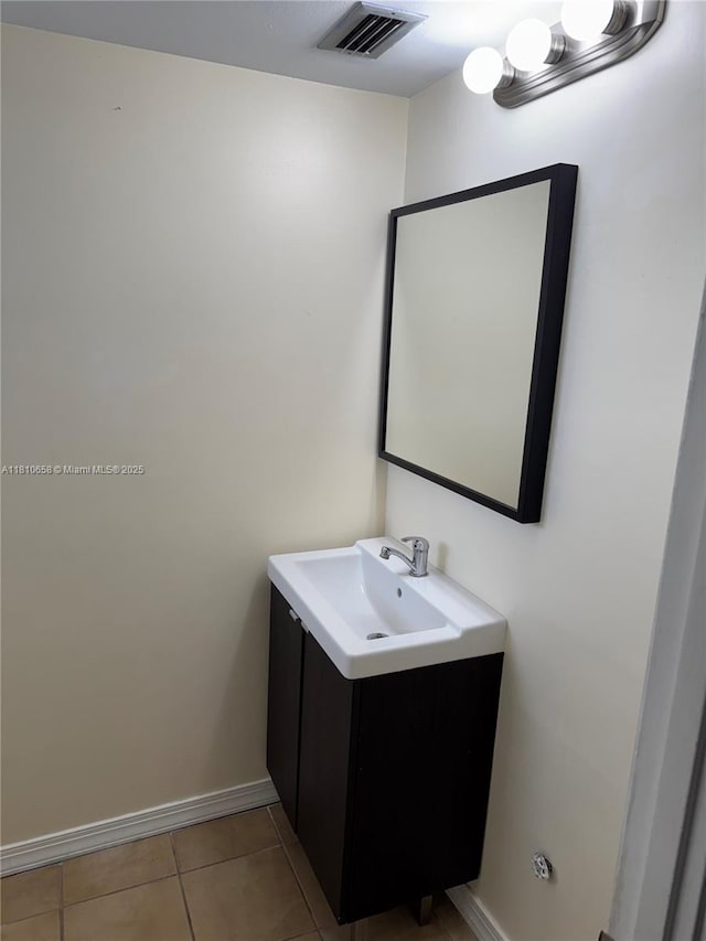1780 NE 191st St Unit 412-2, Miami, FL 33179 - bathroom with vanity, baseboards, and tile patterned flooring