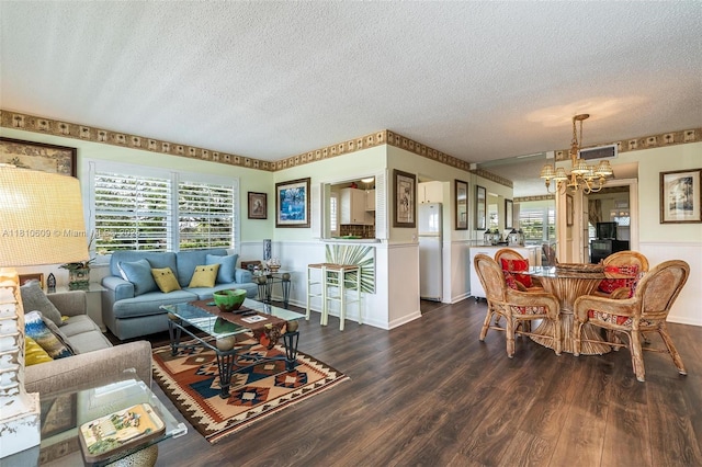 284 Prescott N Unit 284, Deerfield Beach, FL 33442 - living room featuring a textured ceiling, wainscoting, dark wood-style floors, and a chandelier