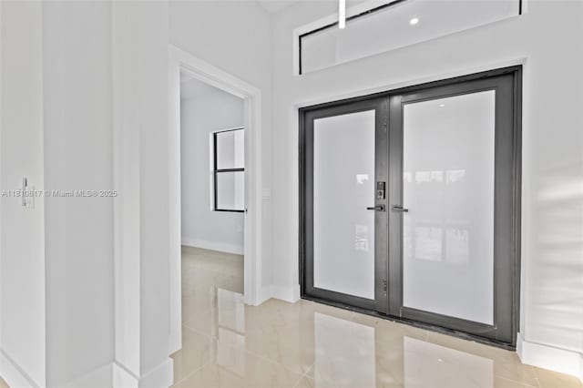 452 Mercedes Ct, Lehigh Acres, FL 33972 - entrance foyer featuring light tile patterned flooring and baseboards