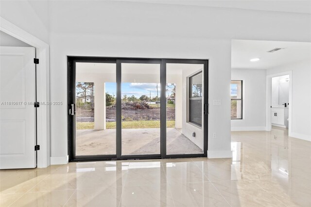 452 Mercedes Ct, Lehigh Acres, FL 33972 - unfurnished room with baseboards and marble tiled floors