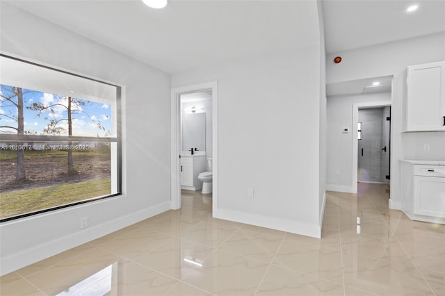452 Mercedes Ct, Lehigh Acres, FL 33972 - empty room featuring baseboards, recessed lighting, and light marble finish flooring
