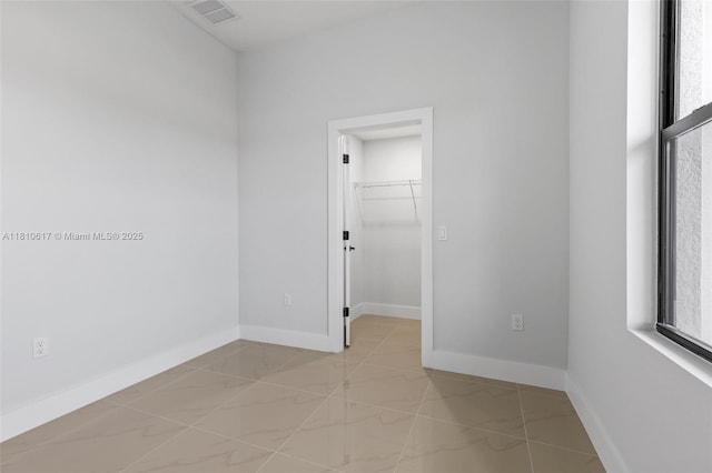 452 Mercedes Ct, Lehigh Acres, FL 33972 - unfurnished room featuring baseboards and light marble finish floors