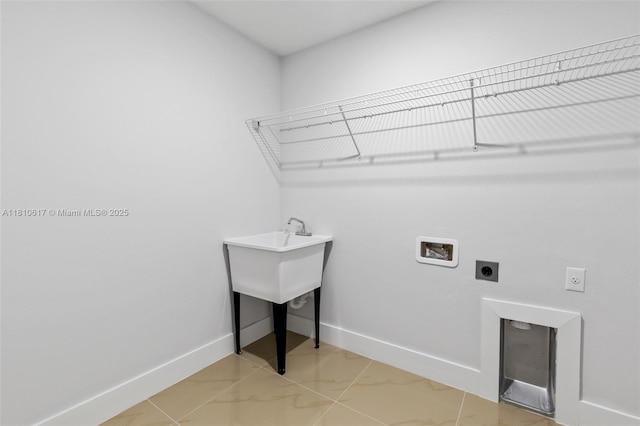 452 Mercedes Ct, Lehigh Acres, FL 33972 - laundry room featuring hookup for an electric dryer, washer hookup, baseboards, and light marble finish floors