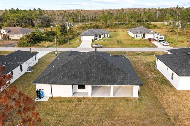 452 Mercedes Ct, Lehigh Acres, FL 33972 - aerial view of property and surrounding area featuring a forest