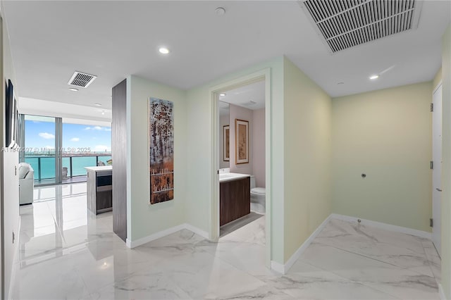 3131 NE 7th Ave Unit 3106, Miami, FL 33137 - hallway with light marble finish flooring, baseboards, and recessed lighting