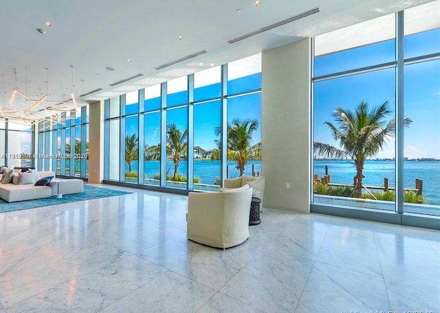 3131 NE 7th Ave Unit 3106, Miami, FL 33137 - lobby with expansive windows, a water view, and a high ceiling