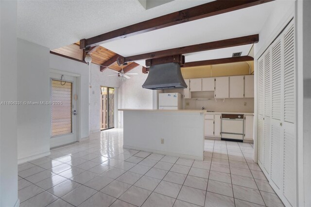 306 Cambridge Rd Unit 2-36, Hollywood, FL 33024 - kitchen featuring white appliances, ventilation hood, light tile patterned floors, a ceiling fan, and light countertops