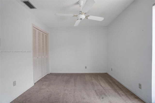 306 Cambridge Rd Unit 2-36, Hollywood, FL 33024 - unfurnished bedroom featuring carpet, a closet, and ceiling fan