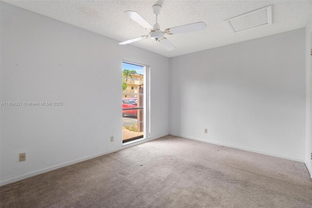 306 Cambridge Rd Unit 2-36, Hollywood, FL 33024 - empty room with light carpet, attic access, baseboards, and a textured ceiling