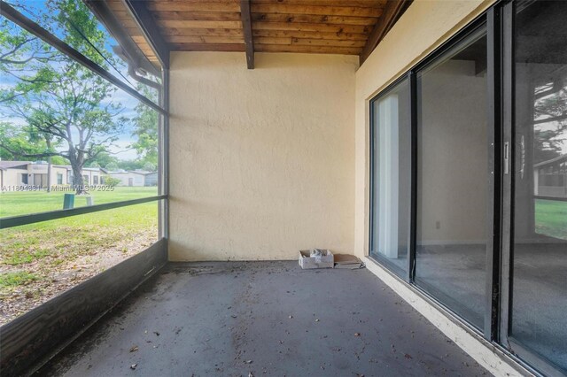306 Cambridge Rd Unit 2-36, Hollywood, FL 33024 - unfurnished sunroom featuring beam ceiling