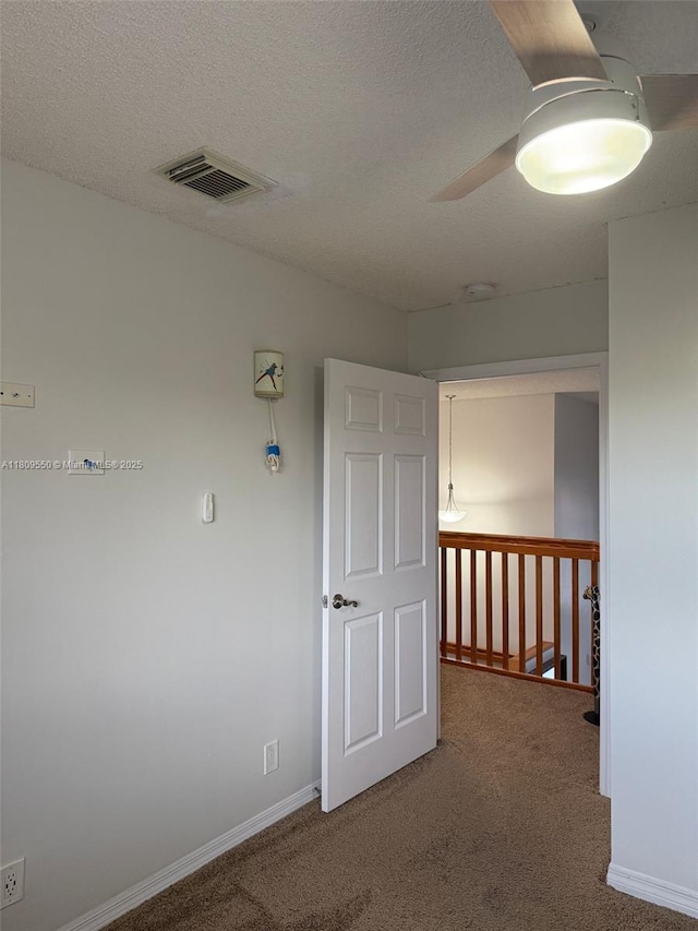 5552 NW 125th Ter, Coral Springs, FL 33076 - empty room with carpet floors, ceiling fan, baseboards, and a textured ceiling