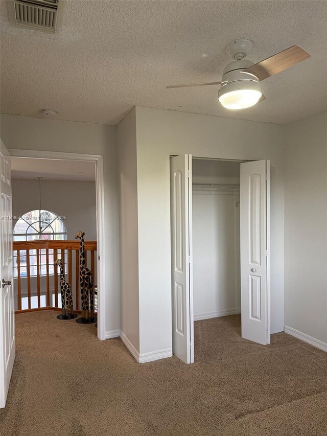 5552 NW 125th Ter, Coral Springs, FL 33076 - corridor featuring carpet flooring, baseboards, and a textured ceiling