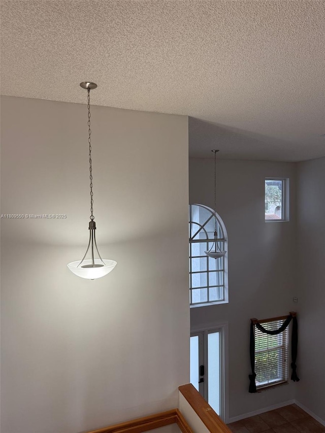 5552 NW 125th Ter, Coral Springs, FL 33076 - detailed view of a textured ceiling and baseboards