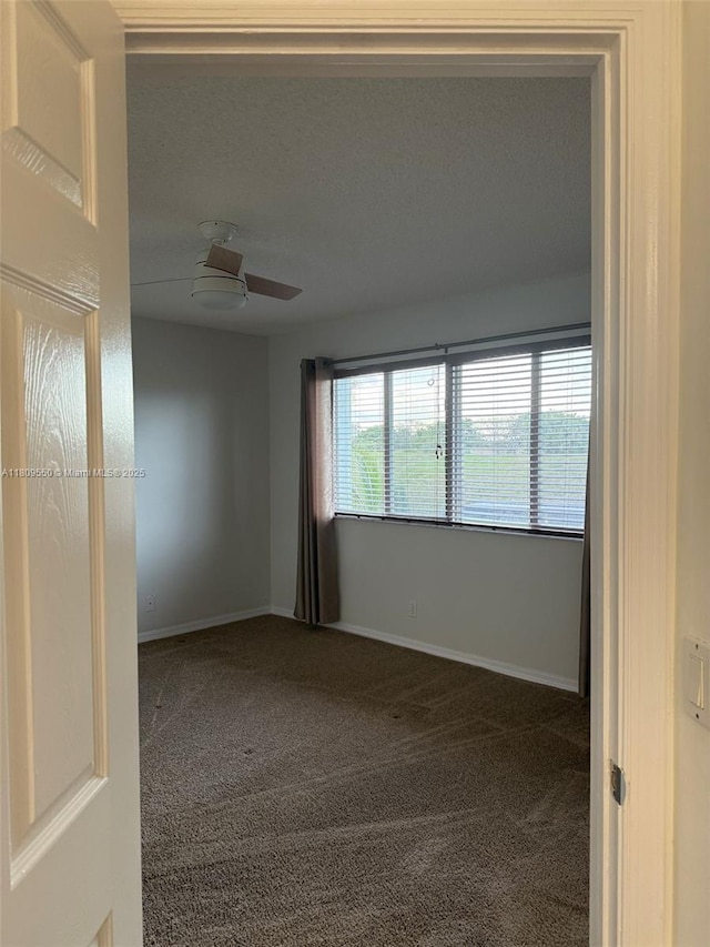 5552 NW 125th Ter, Coral Springs, FL 33076 - spare room featuring carpet floors and baseboards