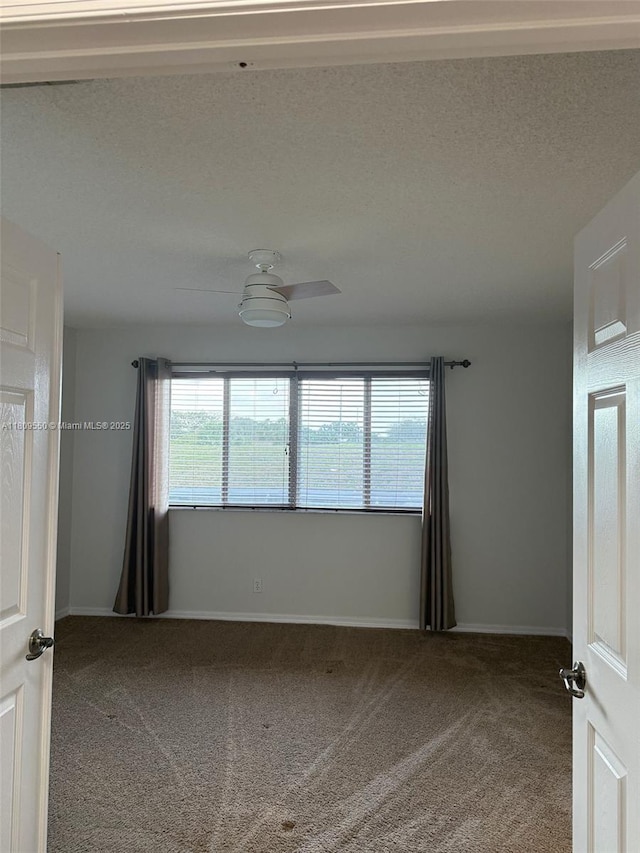 5552 NW 125th Ter, Coral Springs, FL 33076 - spare room featuring carpet, baseboards, and ceiling fan