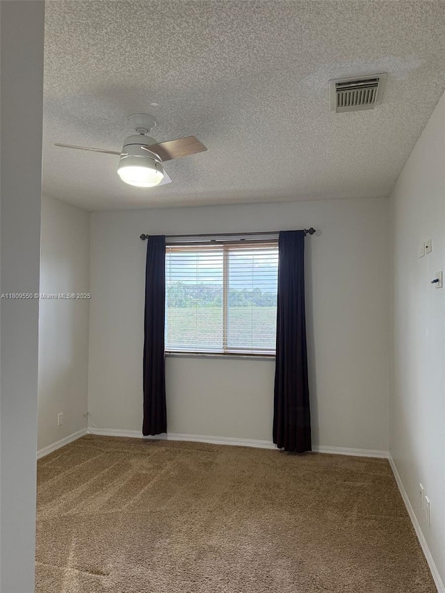 5552 NW 125th Ter, Coral Springs, FL 33076 - carpeted empty room with a textured ceiling, baseboards, and ceiling fan