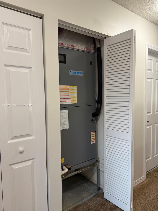 5552 NW 125th Ter, Coral Springs, FL 33076 - utility room featuring heating unit