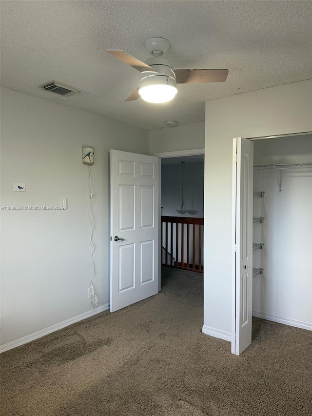 5552 NW 125th Ter, Coral Springs, FL 33076 - unfurnished bedroom with carpet floors, a closet, a textured ceiling, baseboards, and a ceiling fan