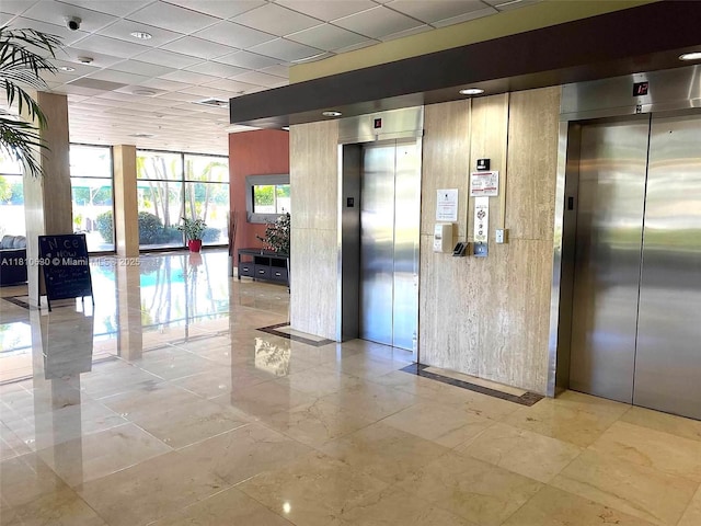 400 Kings Point Dr Unit 318, Sunny Isles Beach, FL 33160 - building lobby with a paneled ceiling and a surveillance system