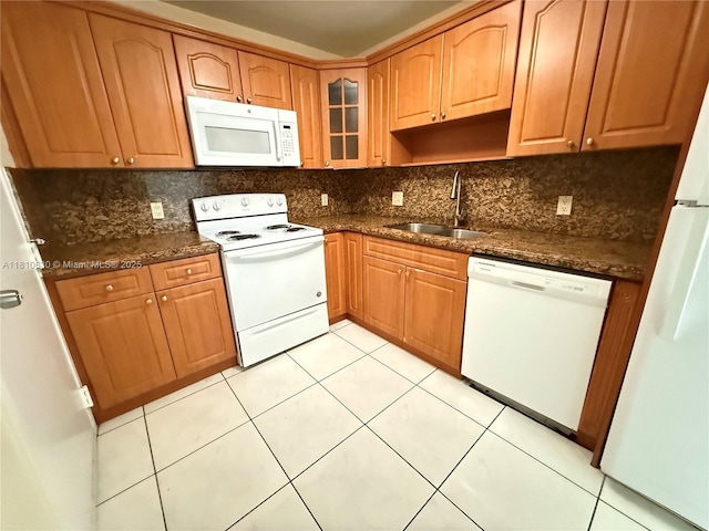 400 Kings Point Dr Unit 318, Sunny Isles Beach, FL 33160 - kitchen featuring white appliances, a sink, backsplash, glass insert cabinets, and light tile patterned flooring