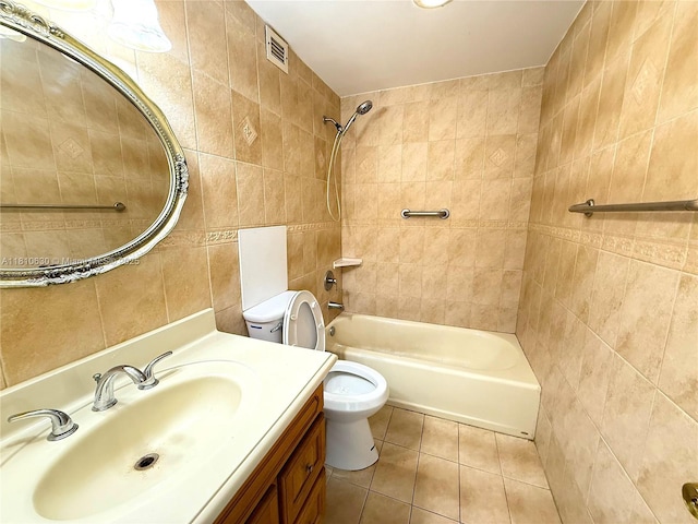 400 Kings Point Dr Unit 318, Sunny Isles Beach, FL 33160 - full bathroom featuring tile walls, toilet, tile patterned floors, shower / bathtub combination, and vanity