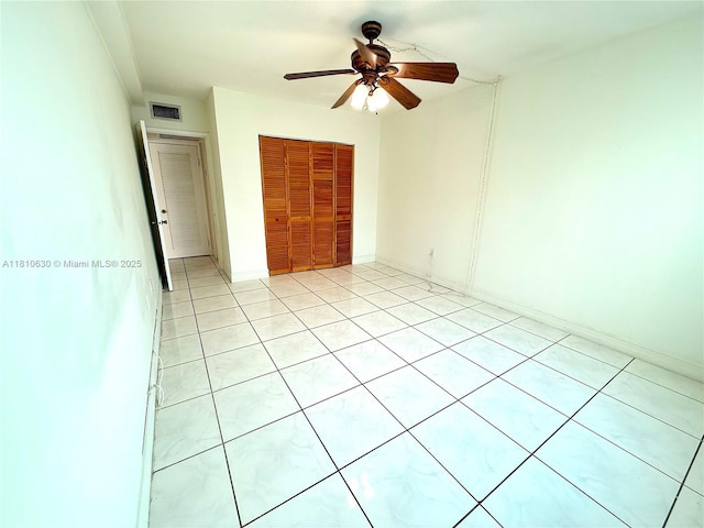 400 Kings Point Dr Unit 318, Sunny Isles Beach, FL 33160 - unfurnished bedroom featuring a closet, ceiling fan, and light tile patterned floors