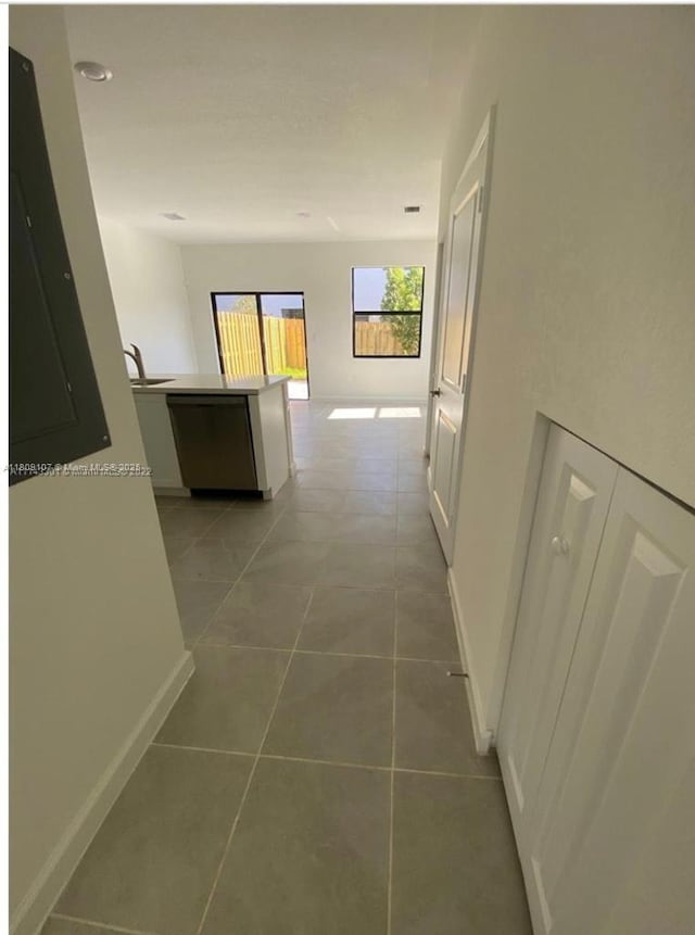28729 SW 132nd Pl Unit 28729, Homestead, FL 33033 - hallway featuring light tile patterned flooring, a sink, and baseboards