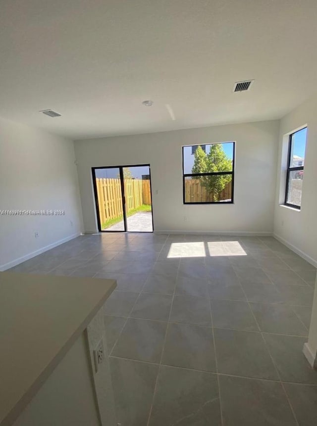 28729 SW 132nd Pl Unit 28729, Homestead, FL 33033 - empty room with dark tile patterned floors and baseboards
