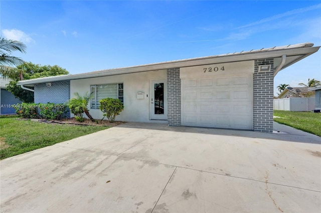 7204 NW 76th Dr, Tamarac, FL 33321 - ranch-style home with driveway, a garage, brick siding, and stucco siding
