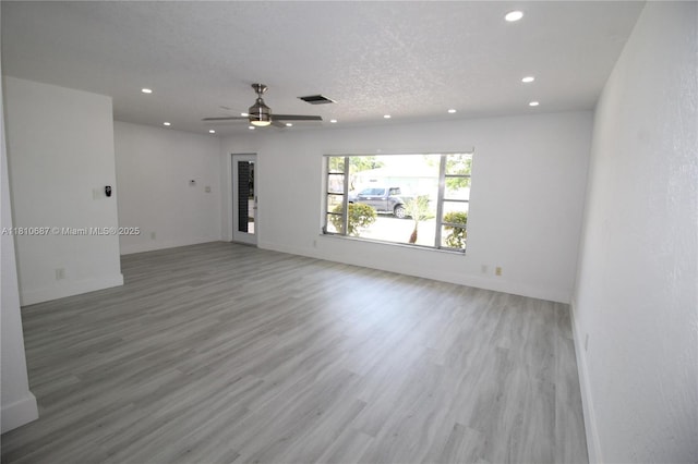7204 NW 76th Dr, Tamarac, FL 33321 - unfurnished living room with recessed lighting, wood finished floors, and ceiling fan