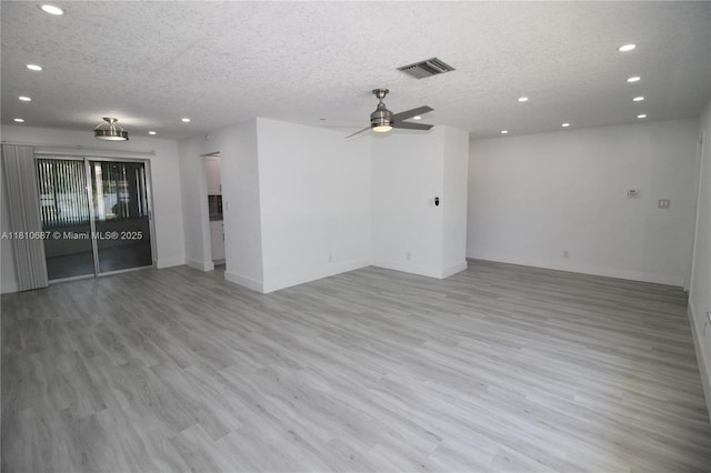 7204 NW 76th Dr, Tamarac, FL 33321 - unfurnished living room with a textured ceiling, recessed lighting, light wood-type flooring, baseboards, and a ceiling fan