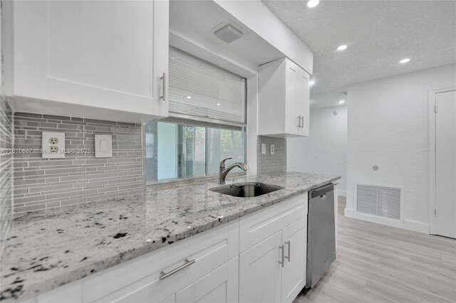 7204 NW 76th Dr, Tamarac, FL 33321 - kitchen with dishwasher, white cabinetry, tasteful backsplash, and recessed lighting