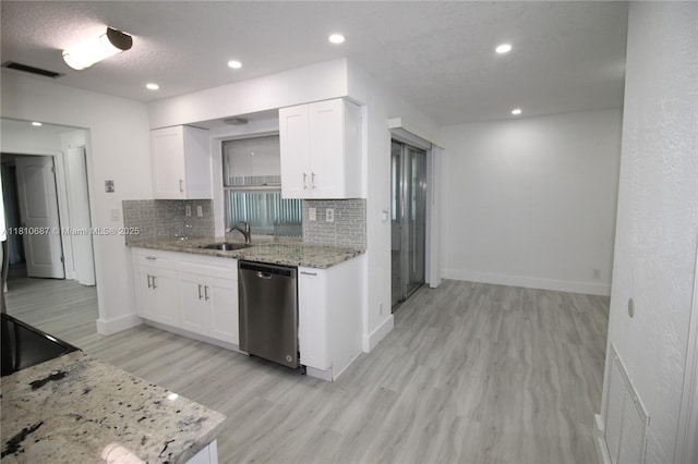 7204 NW 76th Dr, Tamarac, FL 33321 - kitchen featuring dishwasher, a sink, backsplash, light stone countertops, and light wood-style floors