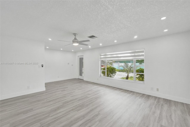 7204 NW 76th Dr, Tamarac, FL 33321 - spare room featuring recessed lighting, light wood-style flooring, a ceiling fan, and a textured ceiling